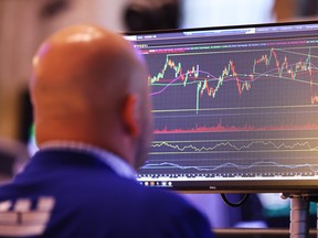 Traders work on the floor of the New York Stock Exchange during morning trading on Aug. 23 in New York City.