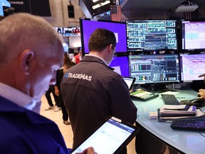 Traders work on the floor of the New York Stock Exchange during morning trading on September 04, 2024 in New York City.