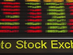 Financial numbers flow on the digital ticker tape at the TMX Group in Toronto's financial district on May 9, 2014. A newly released ranking of the Toronto Stock Exchange's top performers shows investors continue to be attracted to companies at the forefront of the energy transition.