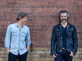 Boat Rocker Media Inc. founders David Fortier, left, and Ivan Schneeberg, right, against a brick wall at their Toronto offices.