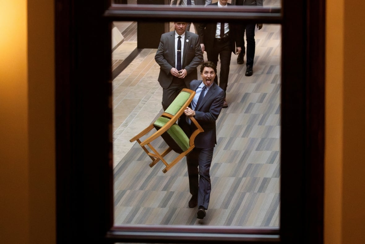 Prime Minister Justin Trudeau carries his chair from the House of Commons on Parliament Hill in Ottawa, Ontario, Canada, March 10, 2025.