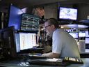 Traders work on the floor of the New York Stock Exchange in New York City. 